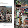 The "Magical Fairy Homes and Gardens" by Schiffer Publishing, Ltd. is a whimsical fairy tavern with a thatched roof, moss, and wood details, ideal for outdoor fairy gardens. Tiny doors and decorations add enchanting charm among twigs and leaves.