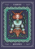 An illustration from the Weird Weavings Runic Oracle by Schiffer Publishing, Ltd. shows a red-haired woman with ram’s horns holding a ram’s head, framed by leaves, the RAIDHO rune above her, and JOURNEY below within a decorative border.