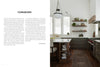 Inspired by Midwest Home from Schiffer Publishing, Ltd., this kitchen features dark cabinets, white countertops, a farmhouse sink, open wood shelves, a patterned rug on dark wood floors, large windows for natural light, and a pendant above the island.