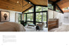Explore "Midwest Home" by Schiffer Publishing, Ltd.—a modern bedroom with floor-to-ceiling windows, wood-panel ceiling, cozy seating area, and an adjacent bathroom featuring a wood vanity and spacious shower.