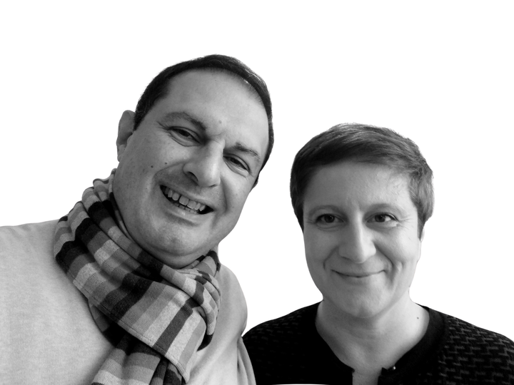 A man in a striped scarf and a woman with short hair smile at the camera against a white background, capturing the playful spirit of 80s design as featured in Schiffer Publishing, Ltd.'s "Iconic Objects of the 1980s.