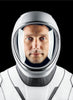 A person in a white and gray space helmet and suit, reminiscent of International Space Station photos, gazes at the camera—evoking the wonder found in Schiffer Publishing, Ltd.’s The Earth from Space Coloring Book.