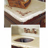 Featuring a Casting Concrete Countertops design by Schiffer Publishing, Ltd., this DIY project includes a rough stone edge, metal sink, wall-mounted bronze faucet, a wicker basket, and embroidered floral details for inspiration.