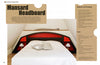 A bed from "The Great Book of Cardboard Furniture" by Schiffer Publishing, Ltd. features a geometric mansard-style headboard with red panels, dark wood trim, eco-friendly materials, and includes instructions in text panels.
